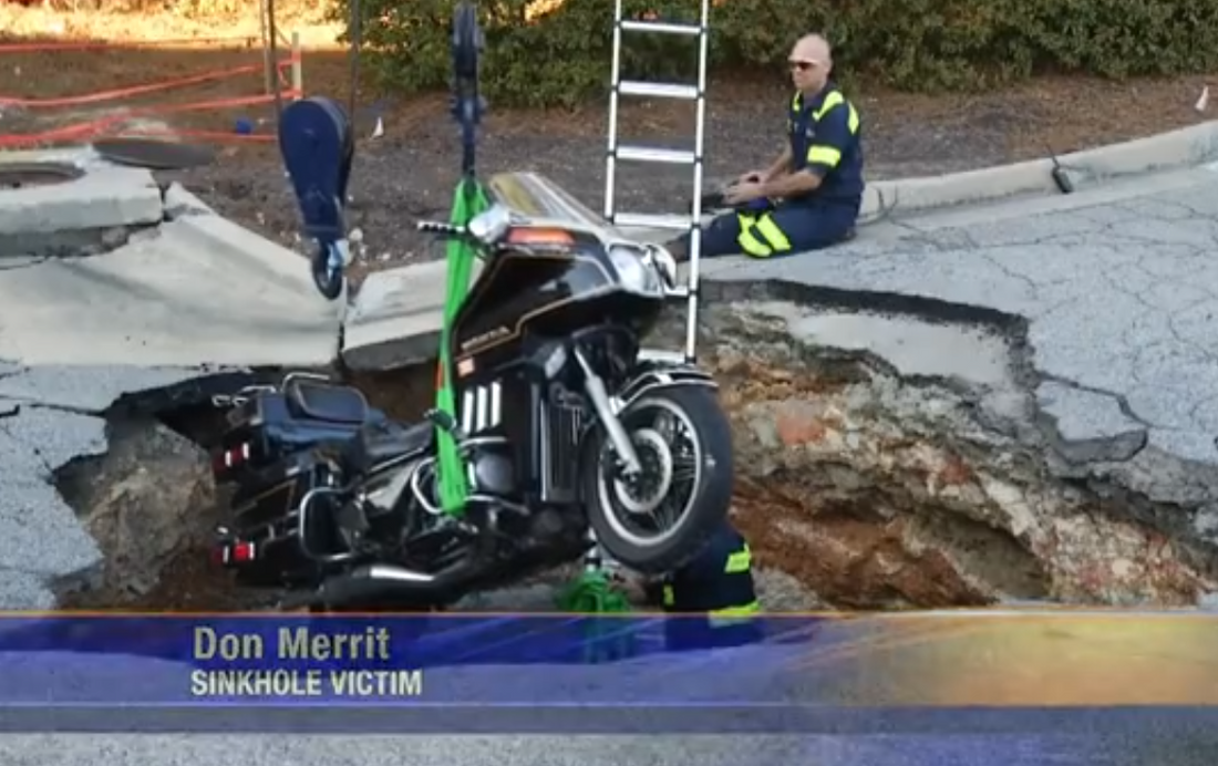 Sinkhole In Shopping Center Swallows Man and Motorcycle; Victim Might Not Be Compensated