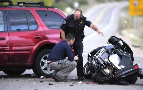 police look at motorcycle accident