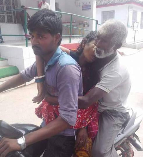 Father and Son transport deceased family member on motorcycle because they couldn't afford an ambulance