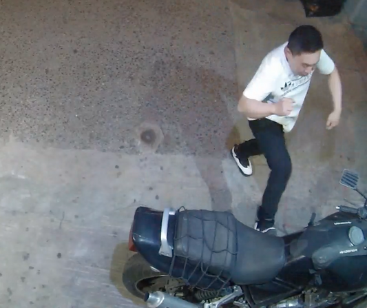 Pissed off or drunk guy takes frustration out on parked motorcycle